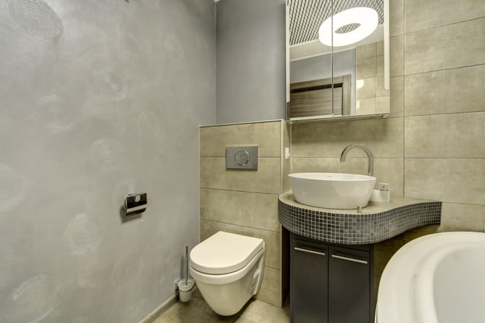 grijs pleisterwerk in het interieur van de badkamer