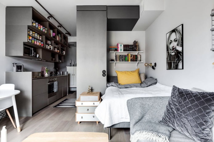 slaapgedeelte in het interieur van een studio-appartement