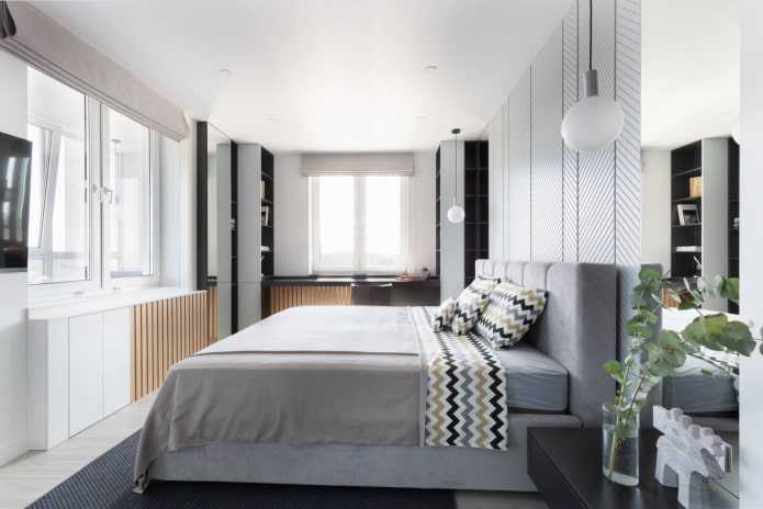 Slaapkamer met een tv aan de muur