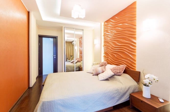 oranje 3D-panelen op de muur in de slaapkamer