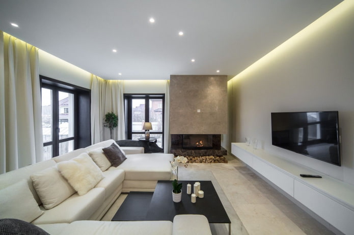 woonkamer met open haard op de hoek van het huis