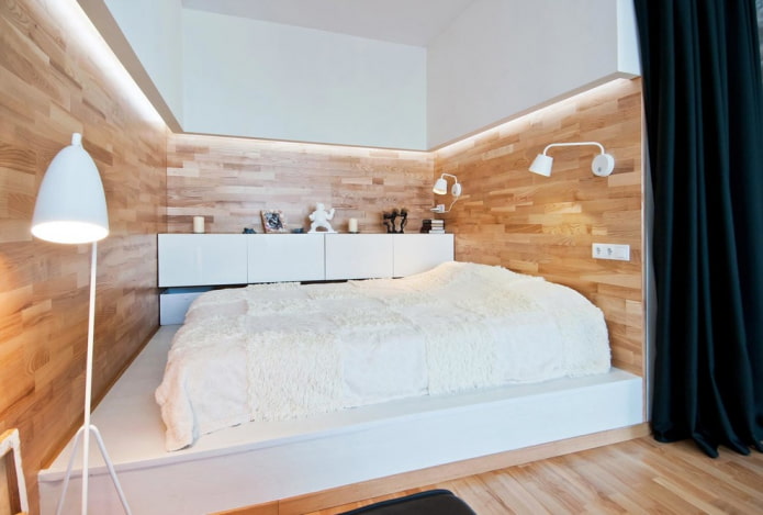 bed op een monolithisch podium in het interieur