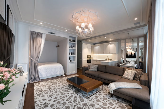 nis met een bed in het interieur van de studio