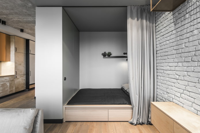 nis met een bed in een loft-interieur