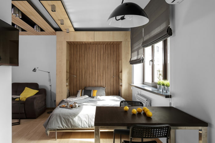 nis met een bed in het interieur van het appartement