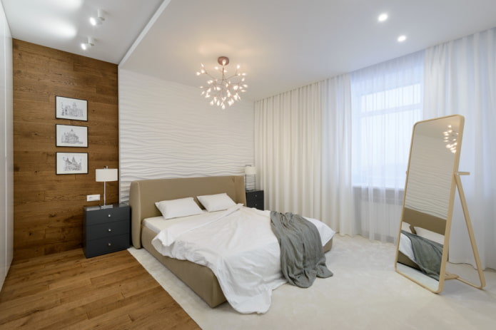 kroonluchter boven het bed in het slaapkamerinterieur