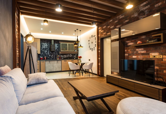 organisatie van de verlichting in het interieur van de keuken-woonkamer