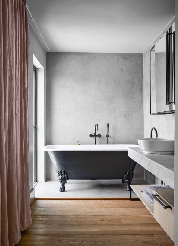 Betonnen muur in de badkamer