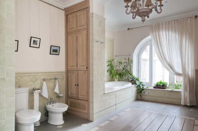een kast in de vorm van een scheidingswand in het interieur van de badkamer