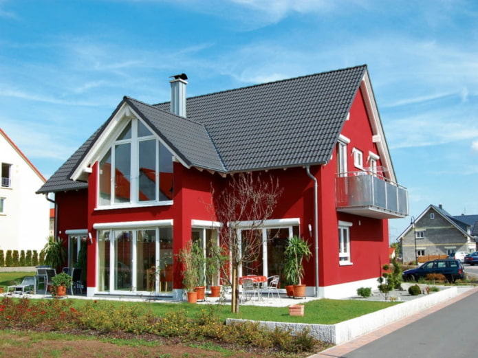 rood huis met een zwart dak
