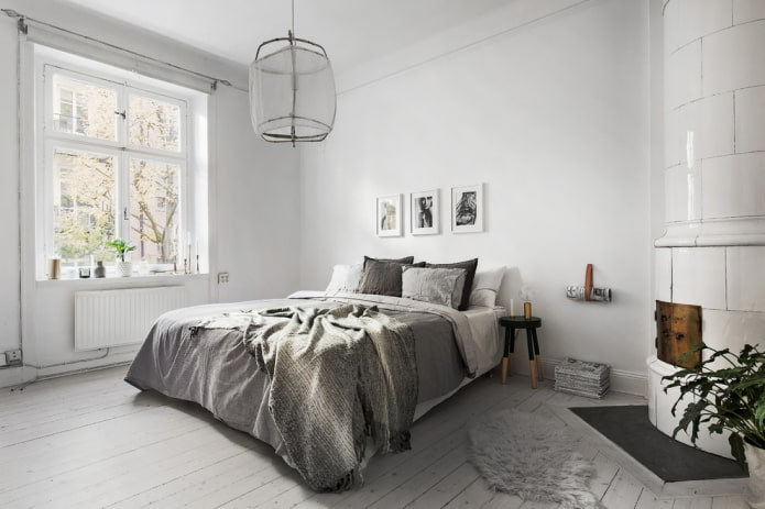 witte muren en een grijs bed