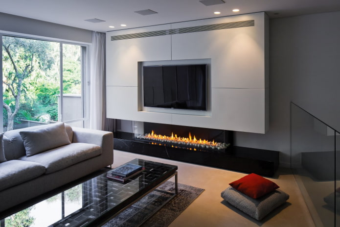 TV-paneel boven de open haard in het interieur